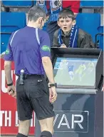  ?? ?? Referee Craig Napier consults VAR