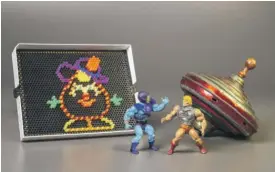  ?? COURTESY OF THE STRONG MUSEUM VIA AP ?? Lite-Brite, Masters of the Universe figures and the top were chosen from among 12 finalists for the Toy Hall of Fame.
