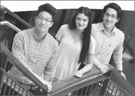  ?? NWA Democrat-Gazette/DAVID GOTTSCHALK ?? Joshua Hong (from left), 18, Kathleen Curlee, 18, and Juan Zuniga, 17, stand Tuesday inside the atrium of Har-Ber High School in Springdale. The seniors received scholarshi­ps to attend universiti­es through a QuestBridg­e program.