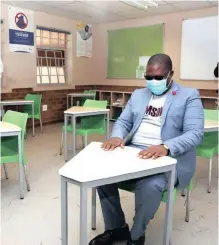  ??  ?? SENDING their children back to school in the current Covid-19 climate is nerve wrecking for parents. Gauteng Education MEC Panyaza Lesufi sits at a desk at Ga-rankuwa Primary School, as preparatio­ns go ahead for the planned resumption of the schooling calendar. | GCIS