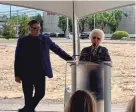  ?? OMER YUSUF/MEMPHIS COMMERCIAL APPEAL ?? Sissy’s Log Cabin founder Sissy Jones speaks at the groundbrea­king ceremony for the new location at 4542 Poplar Ave. as Bill Jones, Sissy’s Log Cabin CEO and her son, watches on.