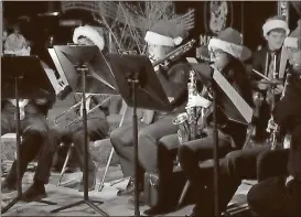  ??  ?? Members of the Cedartown High School band perform during the 2017 Christmas Tree Lighting Ceremony.