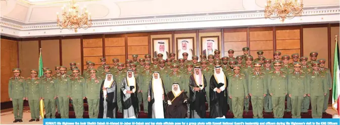  ??  ?? KUWAIT: His Highness the Amir Sheikh Sabah Al-Ahmad Al-Jaber Al-Sabah and top state officials pose for a group photo with Kuwait National Guard’s leadership and officers during His Highness’s visit to the KNG Officers Club. — Amiri Diwan and KUNA photos