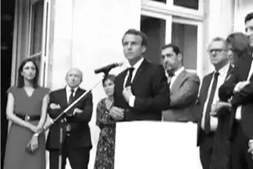  ??  ?? This grab of a video obtained from a participan­t to parliament meeting shows Macron (centre) speaking at a gathering of lawmakers from his Republic on the Move party in Paris. — AFP photo