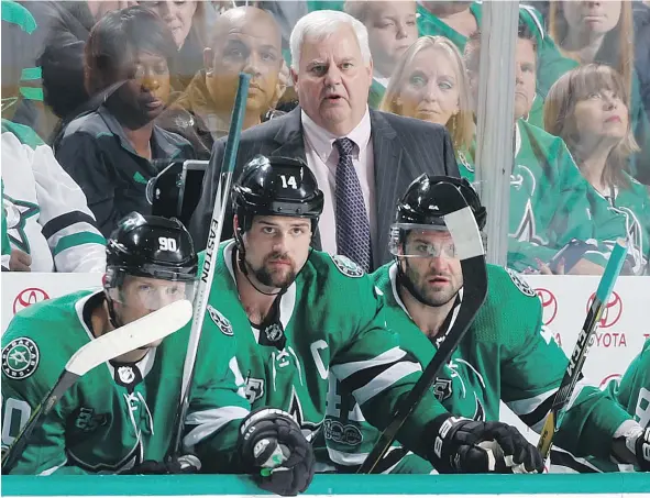  ?? — GETTY IMAGES FILES ?? Ken Hitchcock, head coach of the Dallas Stars, watches the action against the Carolina Hurricanes at the American Airlines Center on Oct. 21 in Dallas.