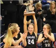  ?? BRYAN EVERSON — FOR MEDIANEWS GROUP ?? Royal Oak senior Megan Haun, who provided the gamewinnin­g assist, hoists the trophy after defeating host Warren Cousino, 43-41, for the Ravens’ first district championsh­ip in program history Friday night.