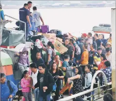  ??  ?? Passengers disembark at Sibu Express Boat Terminal.