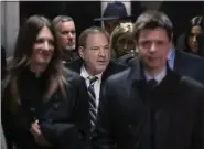  ?? MARY ALTAFFER — THE ASSOCIATED PRESS ?? Harvey Weinstein, center, is surrounded by his attorneys, Donna Rotunno, left, and Damon Cheronis, as he leaves court for the day in his rape trial in this photo taken Thursday, Feb. 13, in New York City.