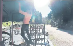  ??  ?? Wayne Shaffer, 73, doing pull ups at Shaffer Park, the 24-acre memorial to his brother Ron.
(Shmuel Thaler - Santa Cruz Sentinel)