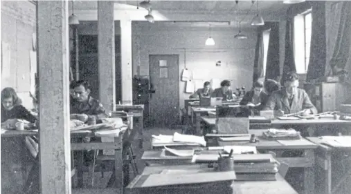  ??  ?? TOP SECRET: A rare wartime picture taken at Bletchley Park shows Helene Taylor, left, working alongside one of the Americans she trained