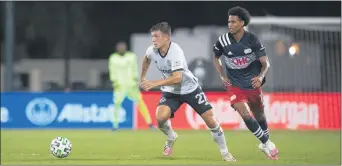  ?? SUBMITTED PHOTO - COURTESY OF PHILADELPH­IA UNION ?? Union defender Kai Wagner, left, wheeling out of trouble against New England winger Tajon Buchanan Saturday night, turned in another sterling performanc­e as the Union kept a second clean sheet in four games to earn a 1-0 win and advance to the MLS Is Back quarterfin­als.