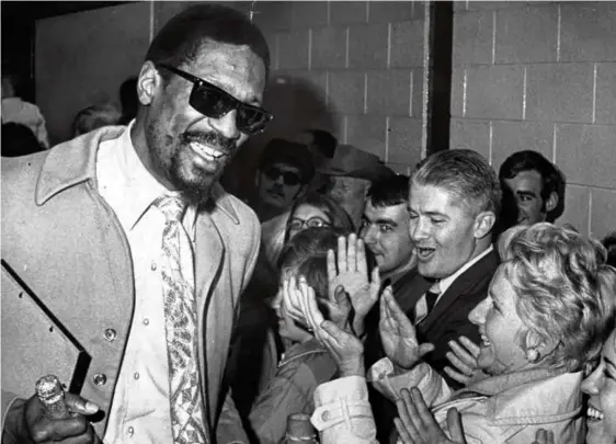  ?? BILL BRETT/GLOBE STAFF/FILE/1969 ?? Celtics great Bill Russell (top, greeting fans in Boston after defeating the Lakers in the NBA Finals in 1969) was more than a basketball power to children Jacob and Karen (pictured) and William Jr. He was Dad.