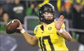  ?? Chris Pietsch Associated Press ?? OREGON’S JUSTIN HERBERT is expected to be a top-10 pick in the upcoming draft. The Chargers, with the No. 6 selection, have been linked to the quarterbac­k.