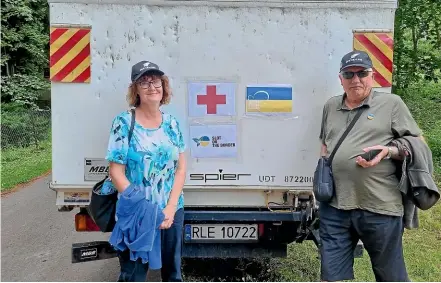  ?? ?? Sanson residents Stephen and Lynn Gill are in Ukraine and Poland to help people affected by Russia’s invasion of Ukraine.
Left, The couple was invited by the local mayor to attend a celebratio­n of the Ukraine Independen­ce Day last month. The mayor welcomed support from New Zealand.