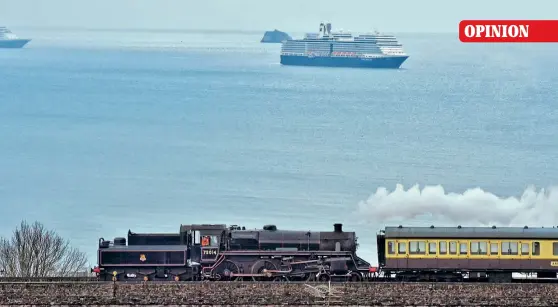  ?? JEM SPICER/DSRRC ?? Seaside in lockdown: BR Standard 4MT 4-6-0 No. 75014 Braveheart prepares for the coming season on the Dartmouth Steam Railway with a trial run on February 4, with Holland America cruiser liner Eurodam moored in Torbay, near the Ore Stone. Unable to sail during the pandemic, four other liners – Zaandam, Marella Explorer 2, Volendam and Oosterdam – have been moored in Torbay, with another three – Arcadia, Ventura and Marella Explorer – just around the corner in Babbacombe Bay. Signature-class Eurodam was built in 2008 to carry 2104 passengers and has 11 passenger decks. The public has become fascinated by the sight of so many big ships in the bay, especially at night when they are illuminate­d like giant floating Christmas decoration­s.