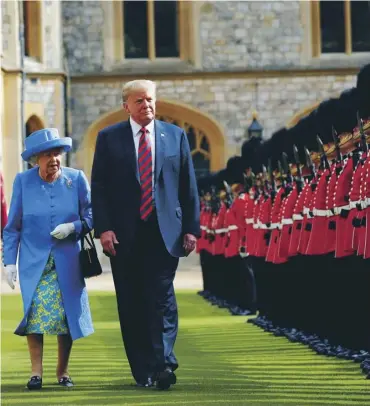  ??  ?? Donald Trump joins the Queen to inspect the Guard of Honour at Windsor Castle