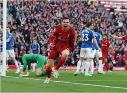  ?? (Reuters) ?? LIVERPOOL DEFENDER Andy Robertson celebrates after scoring the opening goal last night in the 62nd minute of the Reds’ 2-0 Premier League victory over Everton at Anfield.