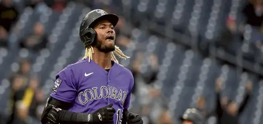  ?? Justin Berl, Getty Images ?? Colorado is 4-22 on the road so far this season and hitting .197 as a team — both historical­ly bad marks.