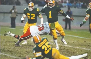  ?? BRIAN GAVRILOFF ?? Reliving an era with their favourite CFL stars of yesteryear, like legendary Eskimos QB Warren Moon, is a large part of the appeal in playing the Sports Action Canadian Pro Football board game.