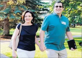  ?? Kevork Djansezian ?? SHERYL SANDBERG and husband David Goldberg attend the annual Allen & Co. conference in Sun Valley, Idaho, in July 2013. Goldberg, 47, died a month ago.