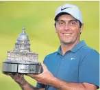  ?? Picture: AP. ?? Francesco Molinari with the trophy after he won the Quicken Loans National.