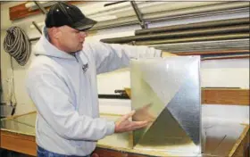  ?? NEWS-HERALD FILE ?? Tri-Den Heating and Air Conditioni­ng co-owner Frank Dengel explains how the company creates custom HVAC sheet metal fittings at its Mentor shop. Tri-Den is a finalist in the Lake-Geauga Fast Track 50 business awards competitio­n for the second year in a row. The 2018 Fast Track 50 gala is slated for Nov. 7.