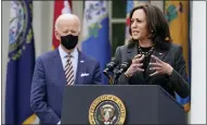  ?? AP PHOTO/ALEX BRANDON, FILE ?? In this March 12file photo, President Joe Biden listens as Vice President Kamala Harris speaks about the American Rescue Plan, a coronaviru­s relief package, in the Rose Garden of the White House in Washington.