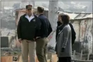  ?? EVAN VUCCI — THE ASSOCIATED PRESS ?? President Donald Trump talks with FEMA Administra­tor Brock Long, Jody Jones, Mayor of Paradise, and California Gov. Jerry Brown, second from right during a visit to a neighborho­od impacted by the wildfires, Saturday in Paradise