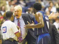  ?? Eric Gay / Associated Press ?? Dallas Mavericks coach Don Nelson, center, and guard Michael Finley argue a call during a game against the Spurs in San Antonio, Texas, in April 2002.