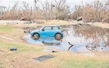  ?? ?? A destroyed vehicle lays among debris after Hurricane Ian passed through the area in Sanibel, Florida.