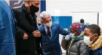  ?? Doug Mills / New York Times ?? Dr. Anthony Fauci, center, seen Tuesday with former President Barack Obama, has been publicly feuding with Sen. Ted Cruz.