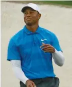  ?? (Photo by Charlie Riedel, AP) ?? Tiger Woods reacts after missing a birdie on the 17th hole during the third round at the Masters.