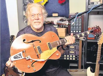  ?? — The Washington Post photos ?? Bachman with the guitar he purchased to trade with Takeshi for his beloved Gretsch guitar, which was stolen in 1976.