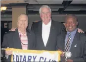  ??  ?? Henry Brenner (center), board member/secretary-treasurer of Shelby County Emergency Communicat­ions District, recently spoke to the members of the Rotary Club of Germantown. He reminded members to call 9-1-1 only when it is a life threatenin­g case or...