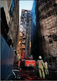  ?? AP/EMRAH GUREL ?? Turkish firefighte­rs work to extinguish a fire that left the Taksim Ilk Yardim hospital in Istanbul badly damaged and forced the evacuation of patients.