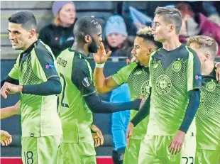  ?? AP. ?? Scott Sinclair, third right, celebrates with team-mates after scoring.