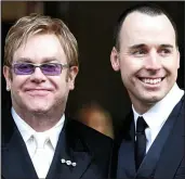  ??  ?? Team: Sir Elton and husband David Furnish