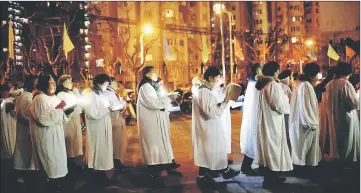 ??  ?? Faithful from a Catholic church take part in a Christmas parade in Shanghai, China. — Reuters photo