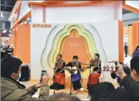  ?? PROVIDED TO CHINA DAILY ?? Performers sing at Kuaishou’s booth during an agricultur­al fair in Chongqing in November.