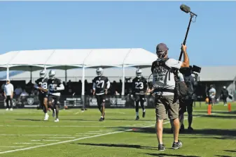  ?? Santiago Mejia / The Chronicle ?? HBO’s “Hard Knocks” crew documents a Raiders practice last month in Napa. The show’s first episode debuted Tuesday. Rookie safety Jonathan Abram played a major role in the episode.