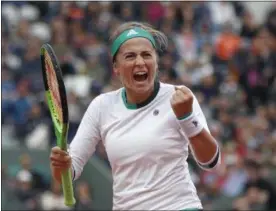  ?? PETR DAVID JOSEK — ASSOCIATED PRESS ?? Latvia’s Jelena Ostapenko clenches her fist after scoring a point against Caroline Wozniacki.