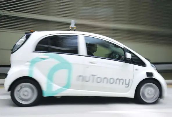  ?? — THE ASSOCIATED PRESS FILES ?? A nuTonomy autonomous vehicle on a test drive in Singapore. General Motors is leading the way to making autonomous vehicle passengers a data mine for marketers and a captive audience for advertiser­s, writes columnist David Booth.