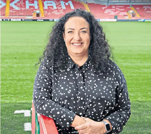  ?? ?? Tinseltown backing: Fleur Robinson found the opportunit­y at Wrexham too good to turn down, despite having to drop two divisions from her post at Burton Albion