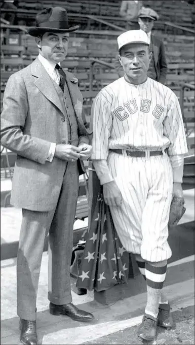  ?? CHICAGO TRIBUNE 1918 ?? ABOVE: Cubs President Charles Weeghman, left, and manager Fred Mitchell pose together during the pennant-winning 1918 season. The Cubs went on to lose the World Series to the Red Sox in six games.