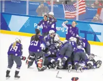  ?? Jae C. Hong / Associated Press ?? The United States women’s hockey team celebrates after winning the gold-medal shootout against Canada.