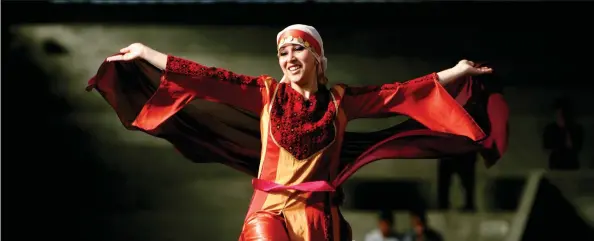  ?? AP PHOTO ?? The thobe, a brightly embroidere­d robe for Palestinia­n women, has long been a staple of Palestinia­n culture. It has recently gained popularity as an expression of Palestinia­n nationalis­m.