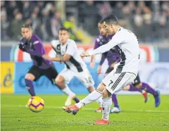  ?? REUTERS ?? Juventus’ Cristiano Ronaldo scores their third goal from the penalty spot.