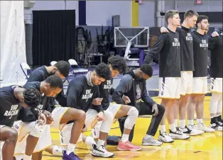  ?? Bob Mayberger / Ualbany Athletics ?? Seven Ualbany basketball players kneeled while others remained standing Saturday night during the national anthem before their game vs. NJIT.