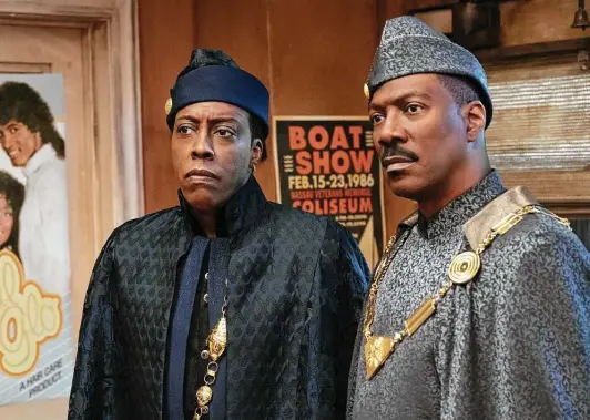  ?? Amazon Studios photos ?? In “Coming 2 America,” King Akeem Joffer (Eddie Murphy, right) and aide Semmi (Arsenio Hall) head back to the United States when the king learns he has a son.