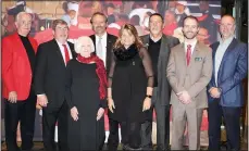  ?? (NWA Democrat-Gazette/Carin Schoppmeye­r) ?? Brandon Burlsworth Foundation Board Members Tommy Tice, Rick Barrows, Anita McCabe, Marty and Vickie Burlsworth, Mike McFarland, Nathan Waldrip and Patrick Swope welcome guests to the Burlsworth Trophy ceremony Dec. 5 at Crystal Bridges Museum of American Art.